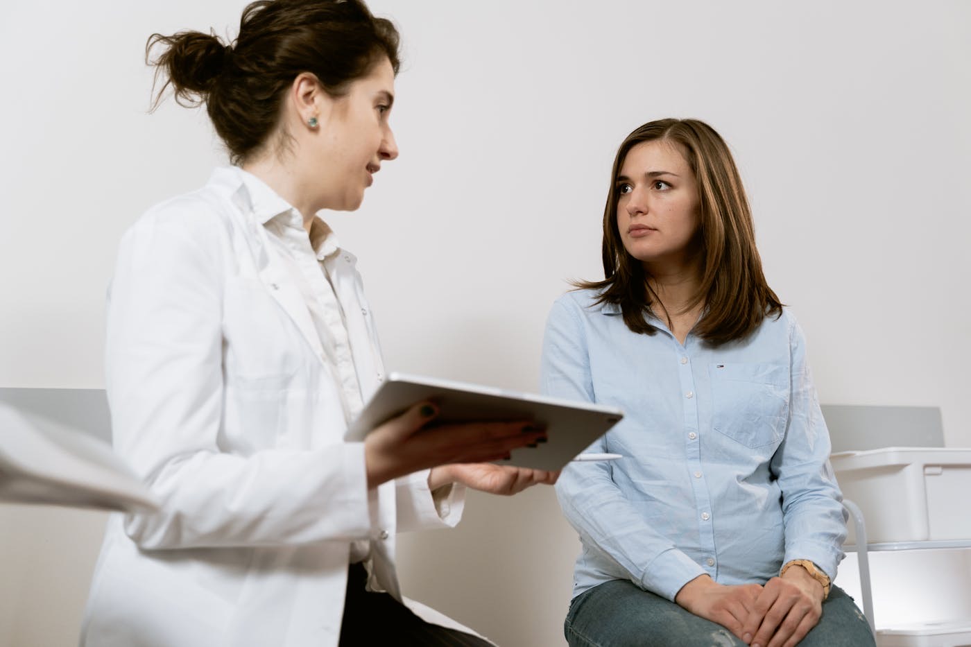 Medical professional reviewing a worker injury case on a tablet